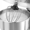 Close-up of a stand mixer whisk attachment in a stainless steel bowl filled with whipped cream or egg whites. Produktbild-Vorschau