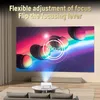 A projector is projecting an image onto a large screen in a living room setting. Produktbild-Vorschau