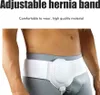 A man wearing a white hernia support belt. Produktbild-Vorschau