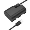 A black dummy battery adapter with a USB-C cable attached, shown on a white background. Produktbild-Vorschau