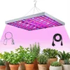 A grow light illuminates several potted plants. Náhled obrázku produktu