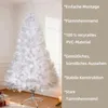 A white artificial Christmas tree is shown in a room with some gift boxes and lights at the bottom. Produktbild-Vorschau