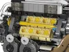 A close-up view of a detailed Lego-style engine model, showcasing its internal components and construction. Voir les images du produit