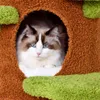 A Ragdoll cat is peeking out of a cat tree house. Produktbild-Vorschau