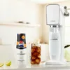 A SodaStream machine, a bottle of Pepsi Max Mango syrup, and a glass of cola with ice are displayed on a countertop. Produktbild-Vorschau