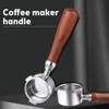 A close-up shot of a coffee maker handle and portafilter, with a second portafilter in the background. Anteprima dell’immagine prodotto