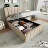 A bed with its storage compartment open, revealing stored items like pillows and suitcases, in a bedroom setting. Náhled obrázku produktu
