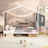 A child's house bed with bedding, decorative bunting, and string lights. Náhled obrázku produktu