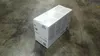 A white product box is placed on a concrete floor. Náhled obrázku produktu
