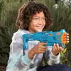 A young person holding a toy gun outdoors. Anteprima dell’immagine prodotto