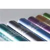 Several rolled-up notebooks or binders in various colors, arranged diagonally. Podgląd zdjęcia produktu