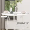 A round white table with decorative items on it, set against a window with greenery visible outside. Produktbild-Vorschau