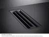 A close-up view of a black induction cooktop with an integrated ventilation grille. Anteprima dell’immagine prodotto