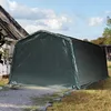 A dark green car tent or storage shelter is set up outdoors next to a building, with a gravel path leading to its entrance. Anteprima dell’immagine prodotto