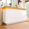A white sideboard with LED lighting and a wooden top, placed in a room with a window and artwork. Voir les images du produit