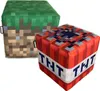 Two Minecraft-themed ottomans, one resembling a grass block and the other a TNT block, are shown against a white background. Podgląd zdjęcia produktu