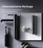 A black faucet and showerhead are displayed on a gray and white background, with a white flower and a black electric toothbrush. Produktbild-Vorschau