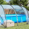 An inflatable pool covered by a transparent dome-like structure in a backyard setting. Anteprima dell’immagine prodotto