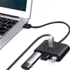 A USB hub connected to a laptop, with several USB drives plugged into it. Náhľad obrázku produktu