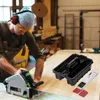 A carpenter is using a circular saw in a workshop, with a tool organizer and a measuring device on a wooden surface. Náhľad obrázku produktu