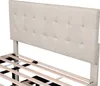 A close-up view of a beige upholstered headboard and bed frame. Produktbild-Vorschau