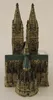 A miniature model of a cathedral with two spires and a green roof, set against a light gray background. Produktbild-Vorschau