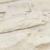 A close-up view of a textured wallpaper with a natural stone or brick pattern. Produktbild-Vorschau