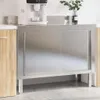 A stainless steel kitchen work table with sliding doors is shown in a kitchen setting. Produktbild-Vorschau
