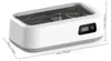 A white and gray ultrasonic cleaner with a digital display and a transparent lid, shown from a diagonal angle. Dimensions are indicated with lines and text. Produktbild-Vorschau