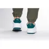 A rear view of a person wearing Puma Slipstream sneakers. Produktbild-Vorschau