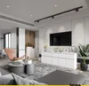 A modern living room with a TV, entertainment unit, and seating area. Náhled obrázku produktu