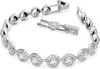 A close-up studio shot of a silver bracelet with clear stones, shown unclasped. Anteprima dell’immagine prodotto