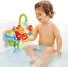 A young child is playing with a bath toy in a bathtub. Podgląd zdjęcia produktu