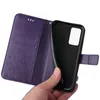 A hand is holding a purple flip phone case with a floral design, showing the inside of the case where a phone would be placed. Produktbild-Vorschau