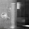 A modern bathroom with a chrome shower system in use. Podgląd zdjęcia produktu