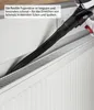 A vacuum cleaner attachment is being used to clean a radiator. Produktbild-Vorschau