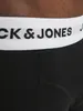 A close-up view of the waistband of black boxer shorts with the 'JACK & JONES' logo printed on it. Podgląd zdjęcia produktu