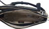 Close-up view of the interior of a black Guess handbag. Produktbild-Vorschau