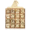A set of wooden Christmas ornaments in a divided box, with a Santa Claus cutout at the top. Produktbild-Vorschau