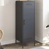 A tall, narrow, dark gray cabinet with a single door and metal legs, placed in a room with light-colored walls and wooden flooring. Podgląd zdjęcia produktu