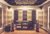 A room set up as a sound studio with acoustic panels on the walls and ceiling, and audio equipment including speakers and amplifiers. Podgląd zdjęcia produktu