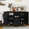 A black kitchen cart with a wooden top, open shelves, and cabinets, displaying various kitchen items like a toaster, wine bottles, and jars. Náhľad obrázku produktu