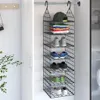A hanging closet organizer filled with clothes and shoes. Anteprima dell’immagine prodotto