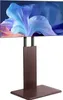 A television on a stand, displaying a colorful abstract image. Produktbild-Vorschau