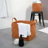 A bathroom setting with storage baskets and towels. Anteprima dell’immagine prodotto