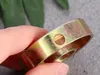 A hand holding a metal ring with a hole in it. Anteprima dell’immagine prodotto