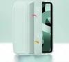 A light green tablet case is shown partially open, revealing a tablet screen with a green abstract pattern. Arrows and lightbulb icons are overlaid on the case. Produktbild-Vorschau