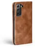 A brown leather flip case for a smartphone is shown against a white background. Produktbild-Vorschau