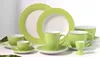 A collection of green and white porcelain tableware, including plates, cups, and an egg cup, arranged on a white surface. Produktbild-Vorschau