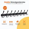 A black wall-mounted coat rack with eight hooks displayed against a white background with informational icons and text. Produktbild-Vorschau